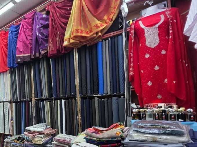 Suiting and shirting fabric rolls and sarees, sold by the metre in Bur Dubai